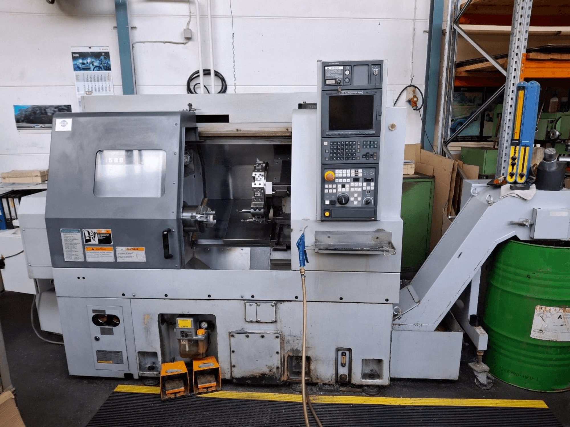 Horizontální soustruh MORI SEIKI CL 1500 T, čelní pohled s ovládacím panelem, viditelnými nástroji a provozním displejem.