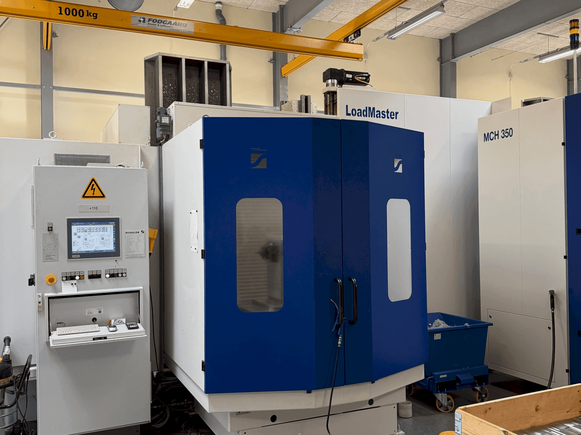 Čelní pohled na HELLER MCH 300 + MCH 300 C + 22 pallet system stroj